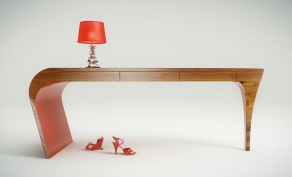 дизайнерско бюро - елегантна и интересна форма и оранжева лампа върху него