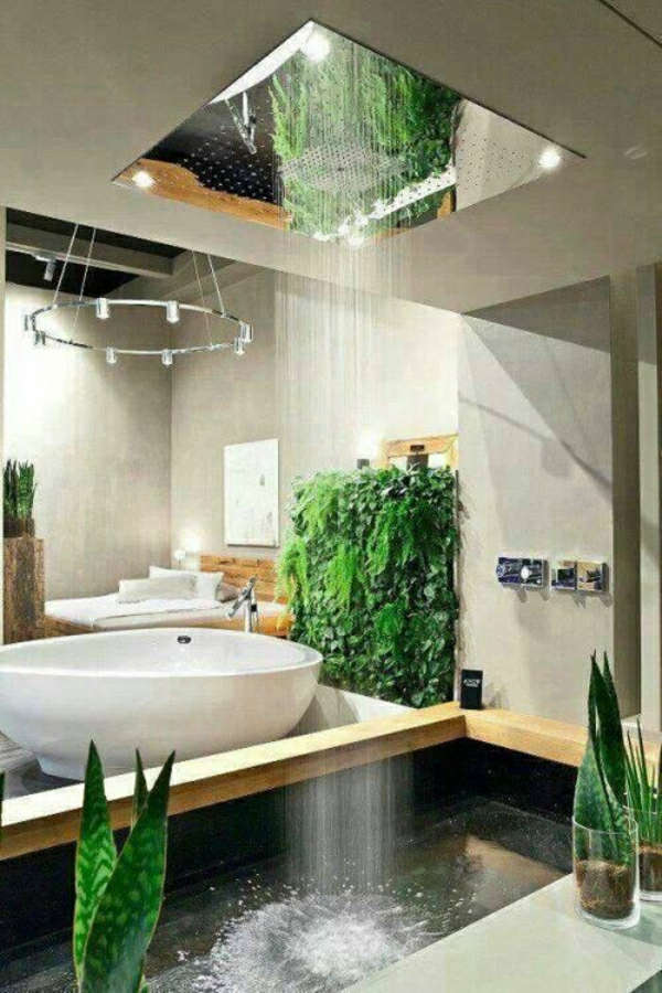 szürke falfesték és zöld növények a fürdőszobában modern zuhanyzóval