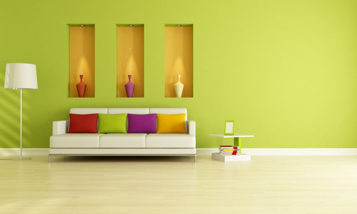 أريكة حديثة وجدار أخضر في غرفة المعيشة