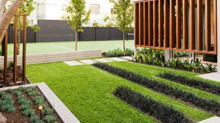 модерна градина дизайн зелена и черна трева на тревата