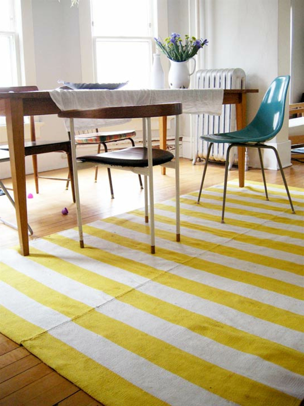 raidallinen-keltainen matto ruokasalissa suunnittelusta
