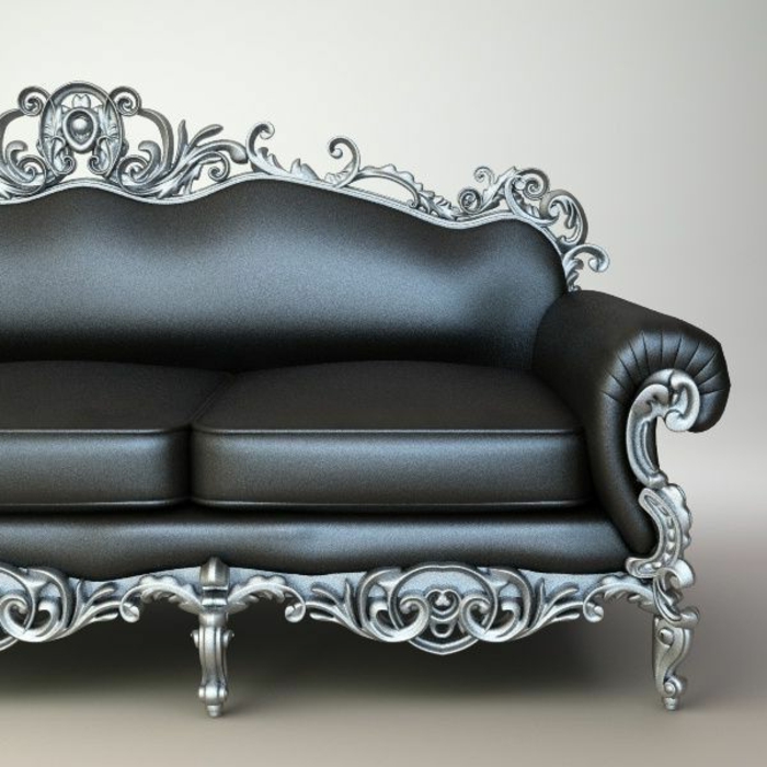 canapé en cuir élégant en couleur graphite avec deux coussins, pieds en métal de couleur grise avec de nombreux ornements gothiques