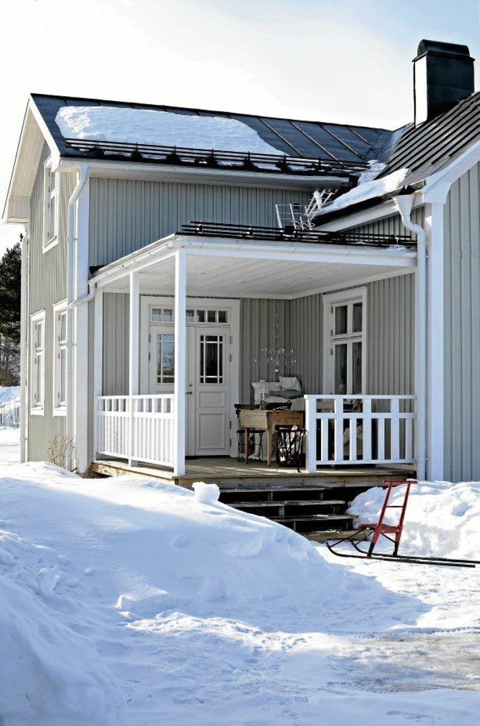 holzhaus-američko-veranda-dizajn-u-snijegu-apsorbira