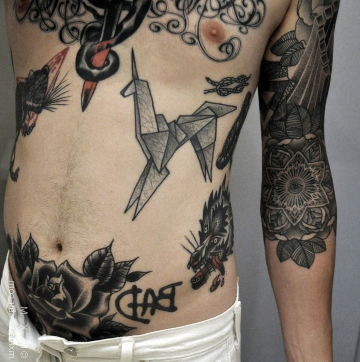 rose, loup, une licorne avec des motifs origami - différentes idées pour les grands tatouages ​​pour les hommes