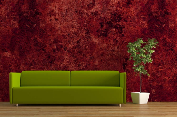 mielenkiintoinen seinärakenne - tummanpunainen - ja sohva vihreällä