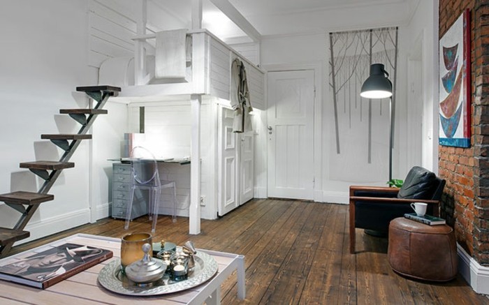 μικρό-διαμέρισμα-set-ξύλο δάπεδο τούβλο στον τοίχο ψηλό κρεβάτι-γραφείο-ξύλο σκάλα-table-tischdeko