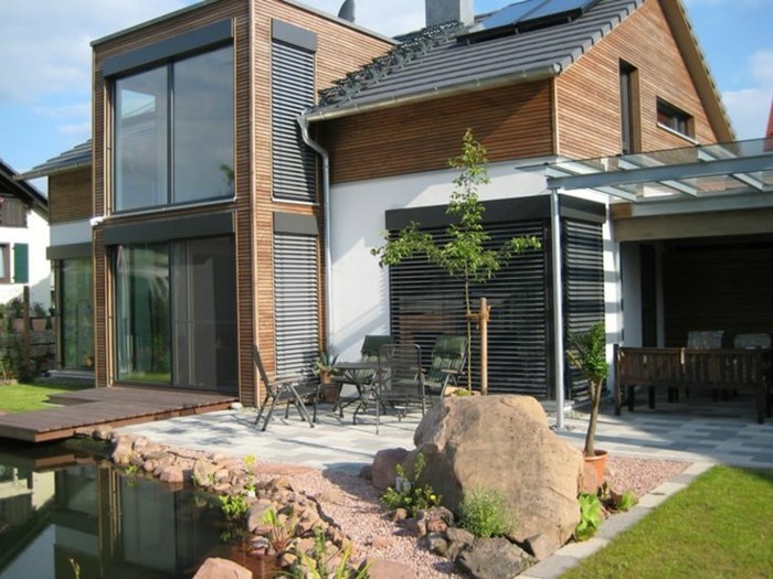 moderna-drvo-kuća-u-verandom-i-zimski vrt