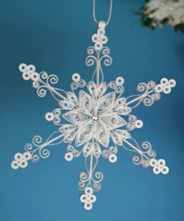 origami-to-christmas-snowflake - φόντο σε μπλε χρώμα