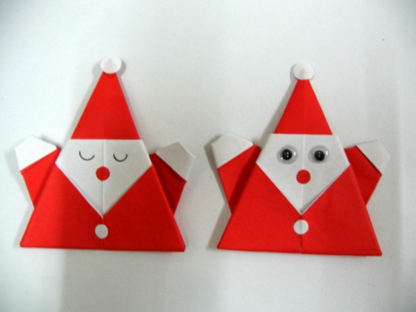 origami-a-navidad-santa claus en la pared blanca