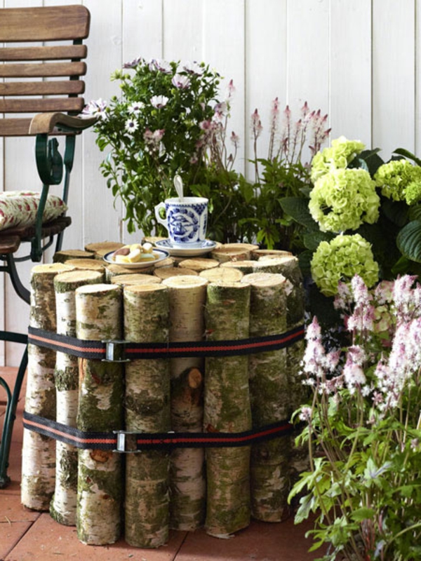 decoración interesante para el jardín - nesttisch construye tú mismo -flores y un banco