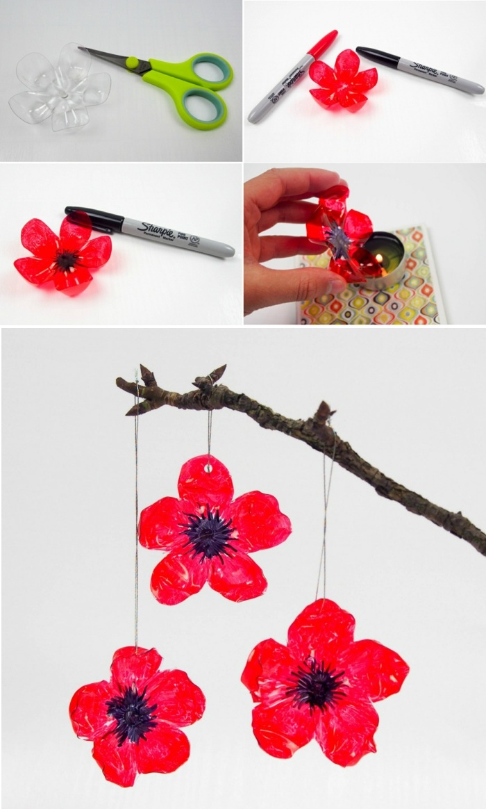décoration de bricolage, plastique fleurs rouges, branche, ciseaux, bougie, marqueur noir