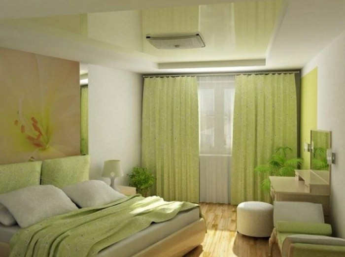لون الجدار الأخضر للاهتمام خزانة وسادة على رأس سرير في واحد في غرفة النوم